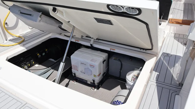 Slide: The Image of Open engine compartment of 2022 Regal 38 SAV boat, showcasing internal components. - 19