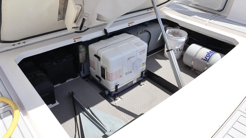 Slide: The Image of 2022 Regal 38 SAV engine compartment with generator and storage items. - 20