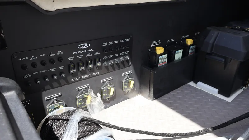 Slide: The Image of Electrical panel of 2022 Regal 38 SAV boat, featuring switches and controls. - 23