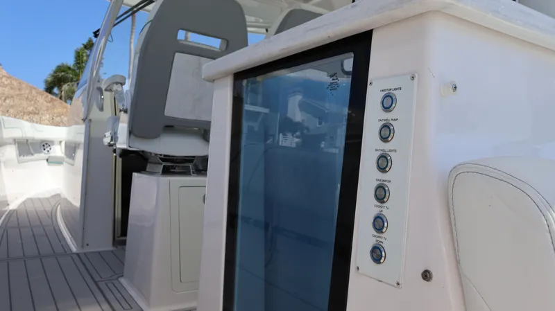 Slide: The Image of 2022 Regal 38 SAV boat interior with control panel and seating area. - 35