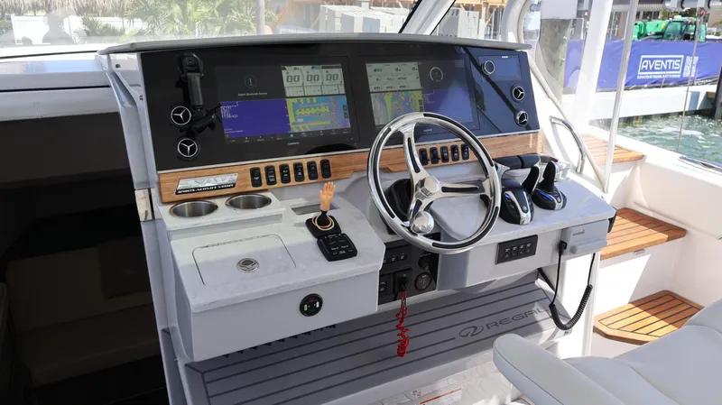 Slide: The Image of 2022 Regal 38 SAV helm with modern controls and navigation displays. - 41