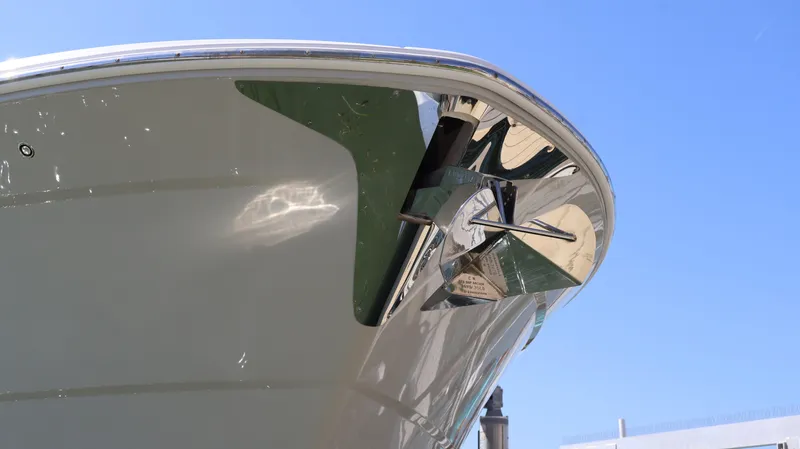 Slide: The Image of 2022 Regal 38 SAV boat bow with anchor, under clear blue sky. - 8