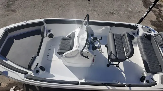 Slide: The Image of 2026 ALK2 Powerboats 23CRX interior, featuring sleek seating and modern design. - 13