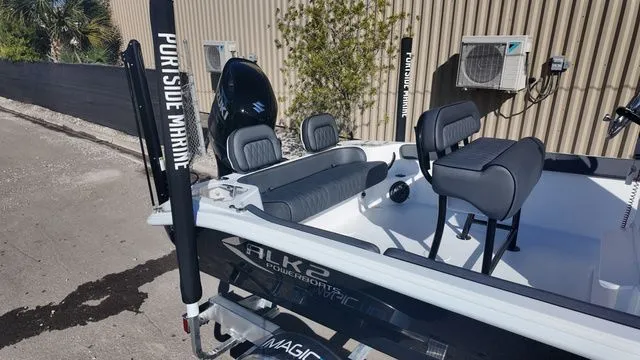 Slide: The Image of 2026 ALK2 Powerboats 23CRX with sleek seating and modern design in a marina setting. - 14