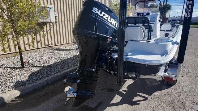 Slide: The Image of 2026 ALK2 Powerboats 23CRX with Suzuki outboard motor, parked on a sunny day. - 15