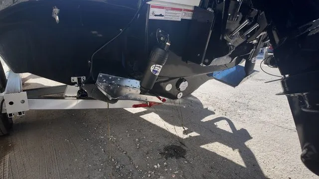 Slide: The Image of Rear view of 2026 ALK2 Powerboats 23CRX showing engine and trailer details. - 18