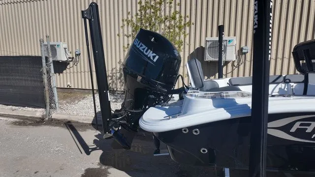 Slide: The Image of 2026 ALK2 Powerboats 23CRX with Suzuki outboard motor, parked outdoors. - 20