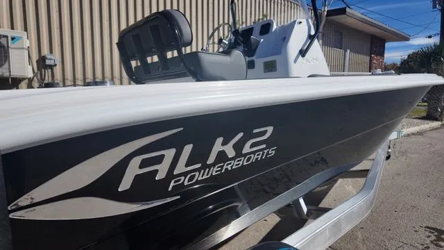 Slide: The Image of 2026 ALK2 Powerboats 23CRX on trailer, side view with logo visible. - 21
