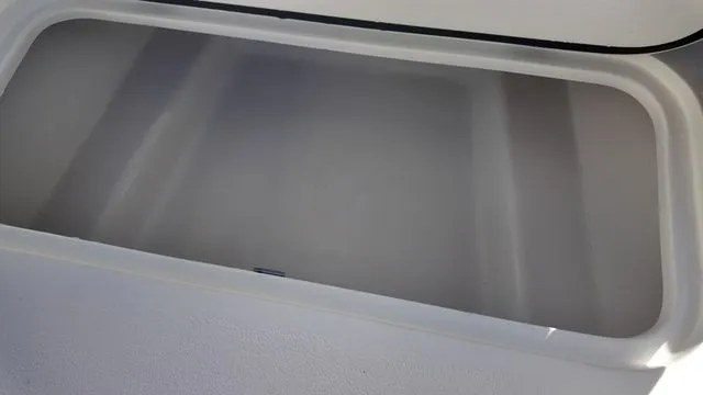 Slide: The Image of Storage compartment of 2026 ALK2 Powerboats 23CRX, open and empty. - 26