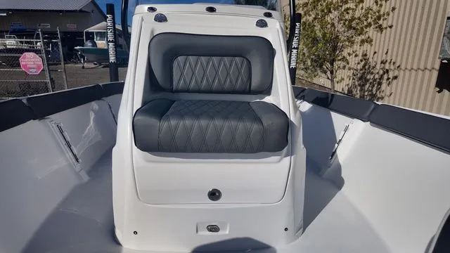 Slide: The Image of 2026 ALK2 Powerboats 23CRX interior with cushioned seating and sleek design. - 27