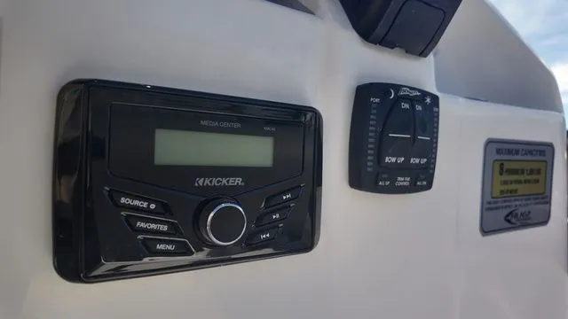 Slide: The Image of Control panel of 2026 ALK2 Powerboats 23CRX featuring Kicker media center. - 31