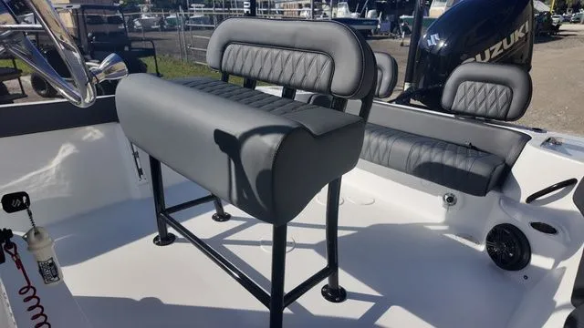 Slide: The Image of 2026 ALK2 Powerboats 23CRX interior with gray seating and Suzuki engine. - 34