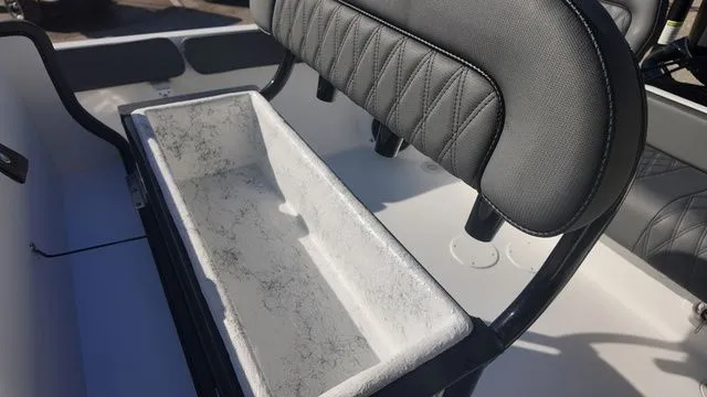 Slide: The Image of 2026 ALK2 Powerboats 23CRX interior with cushioned seating and storage compartment. - 35