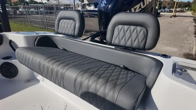 Slide: The Image of 2026 ALK2 Powerboats 23CRX with sleek, diamond-stitched gray seating and Suzuki engine. - 4