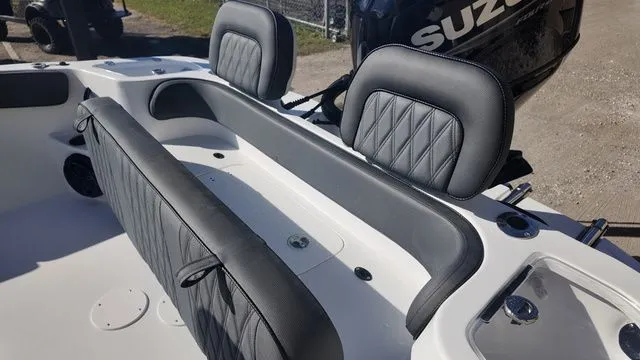 Slide: The Image of 2026 ALK2 Powerboats 23CRX interior with black leather seats and Suzuki engine. - 42