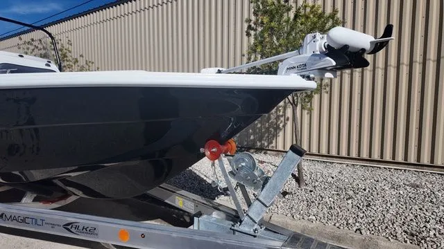 Slide: The Image of 2026 ALK2 Powerboats 23CRX on trailer, featuring Minn Kota trolling motor. - 8