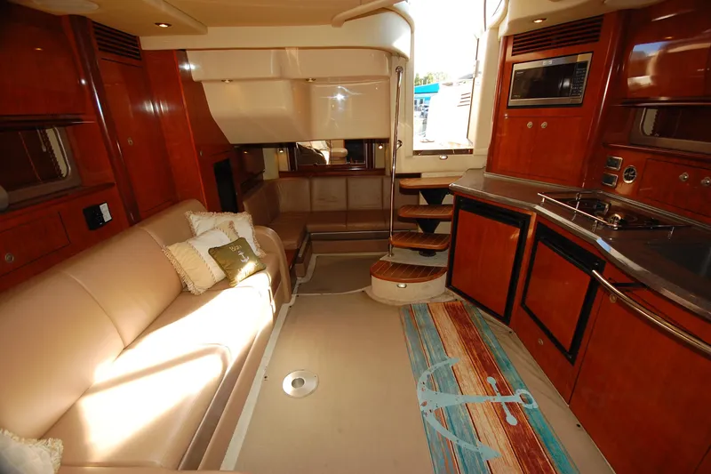 Slide: The Image of Luxurious interior of 2004 Sea Ray 390 Sundancer yacht with elegant wood finishes. - 22