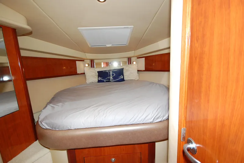 Slide: The Image of Luxurious cabin interior of 2004 Sea Ray 390 Sundancer yacht with cozy bedding. - 24