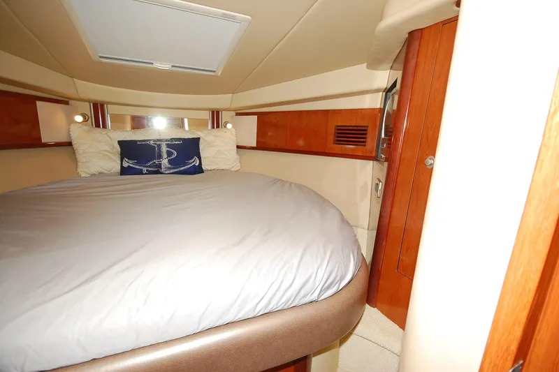 Slide: The Image of Luxurious cabin interior of 2004 Sea Ray 390 Sundancer yacht with cozy bedding. - 26
