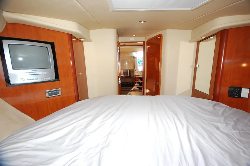 Slide: The Image of Interior cabin of 2004 Sea Ray 390 Sundancer yacht with bed and TV. - 28