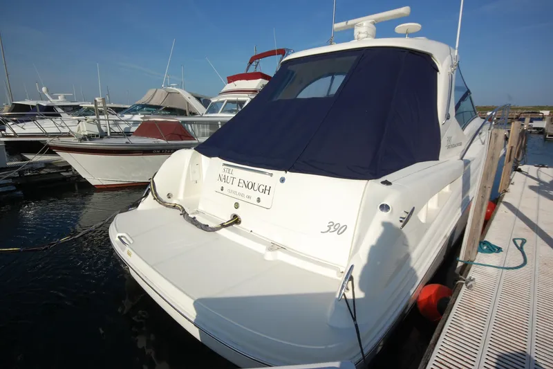 Slide: The Image of 2004 Sea Ray 390 Sundancer yacht docked at marina with blue cover. - 3