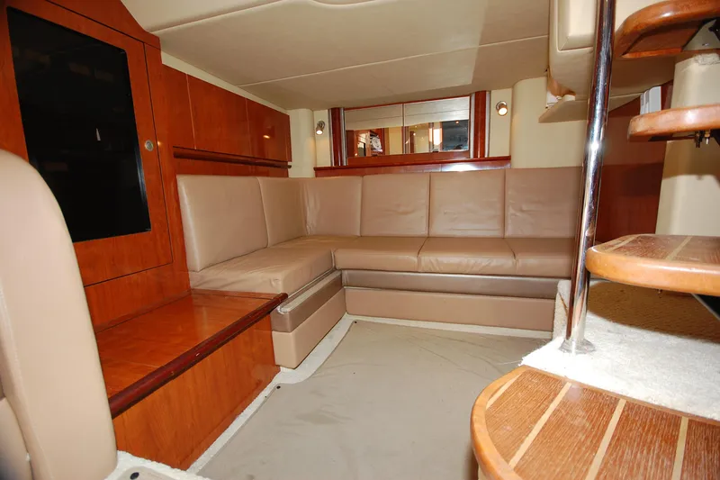 Slide: The Image of Luxurious interior of 2004 Sea Ray 390 Sundancer yacht with leather seating and wooden accents. - 30