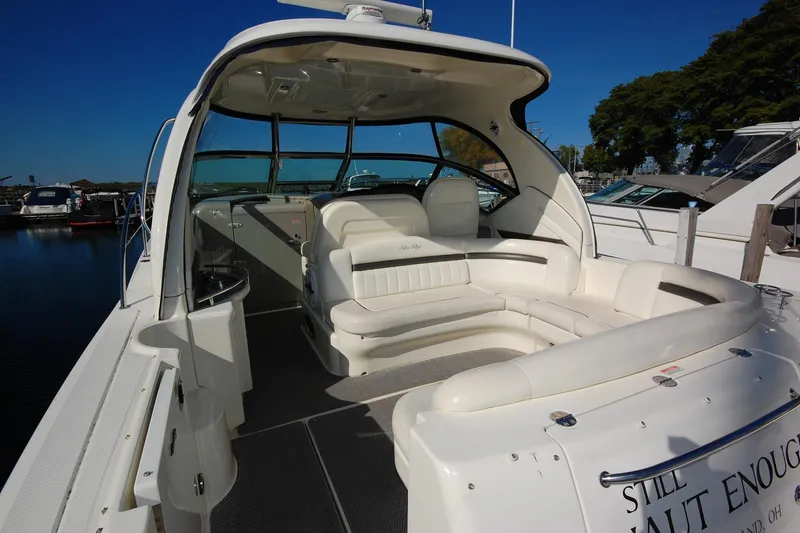 Slide: The Image of 2004 Sea Ray 390 Sundancer yacht with spacious seating area at the dock. - 7