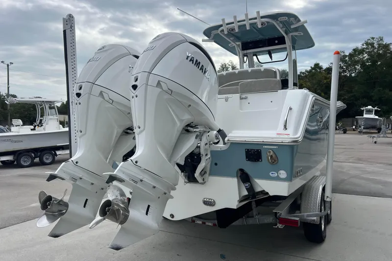 Slide: The Image of 2025 Sea Hunt Gamefish 27 with dual Yamaha outboard engines on a trailer. - 3