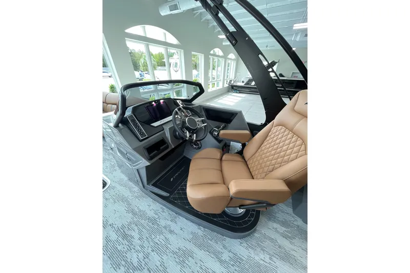 Slide: The Image of Luxurious interior of 2026 Starcraft RX 25 DL DC boat with tan leather seating. - 5