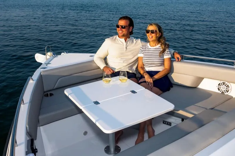 Slide: The Image of Couple enjoying a sunny day on a 2026 Cruisers Yachts 38 VTR. - 4