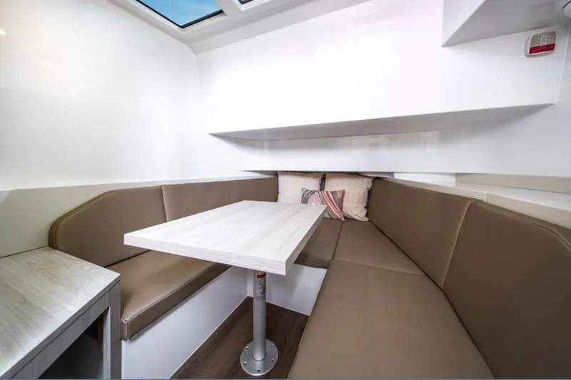 Slide: The Image of 2026 Cruisers Yachts 38 VTR interior with cozy seating and modern table design. - 9