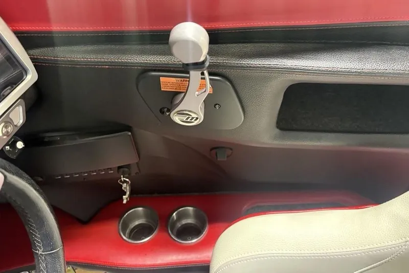 Slide: The Image of Interior of 2015 Malibu Wakesetter 247 LSV with gear lever and cup holders. - 21