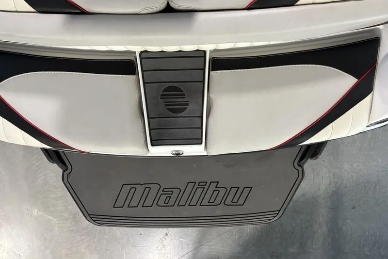 Slide: The Image of 2015 Malibu Wakesetter 247 LSV boat interior with branded mat and stylish seating. - 26
