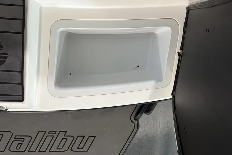 Slide: The Image of 2015 Malibu Wakesetter 247 LSV boat compartment with logo detail. - 33