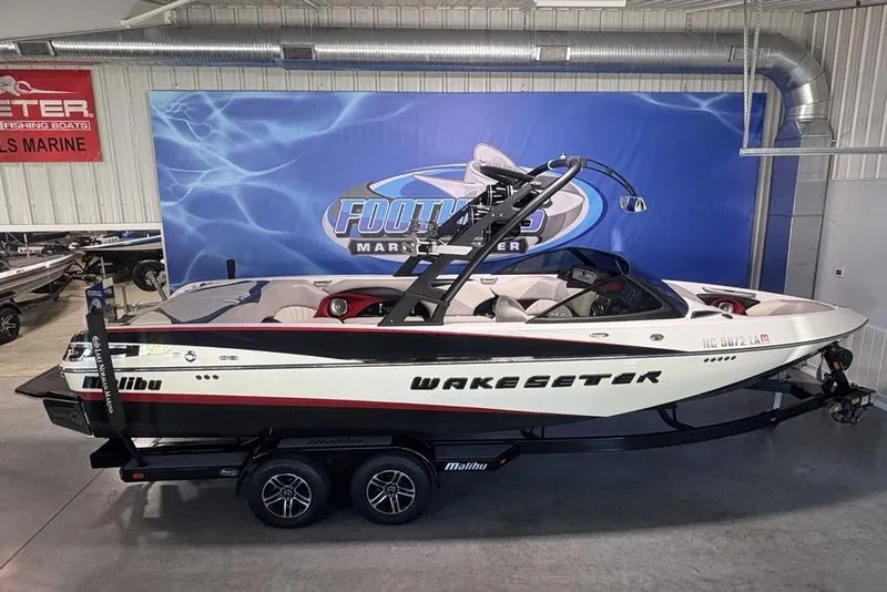 Slide: The Image of 2015 Malibu Wakesetter 247 LSV boat on trailer in showroom. - 37