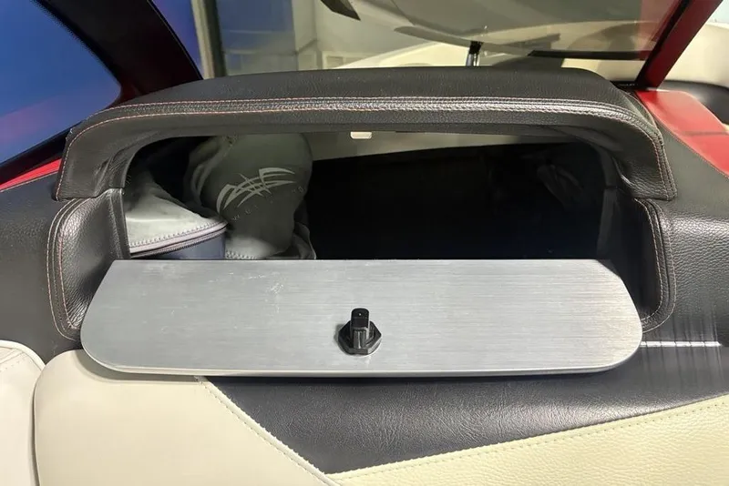 Slide: The Image of Storage compartment in a 2015 Malibu Wakesetter 247 LSV boat interior. - 8