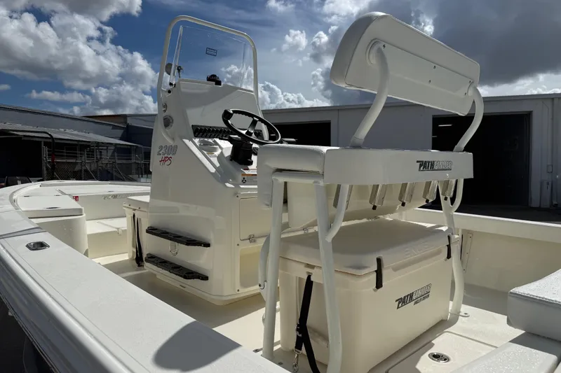 Slide: The Image of 2026 Pathfinder 2300 HPS boat on trailer with Yamaha outboard motor in sunny setting. - 3