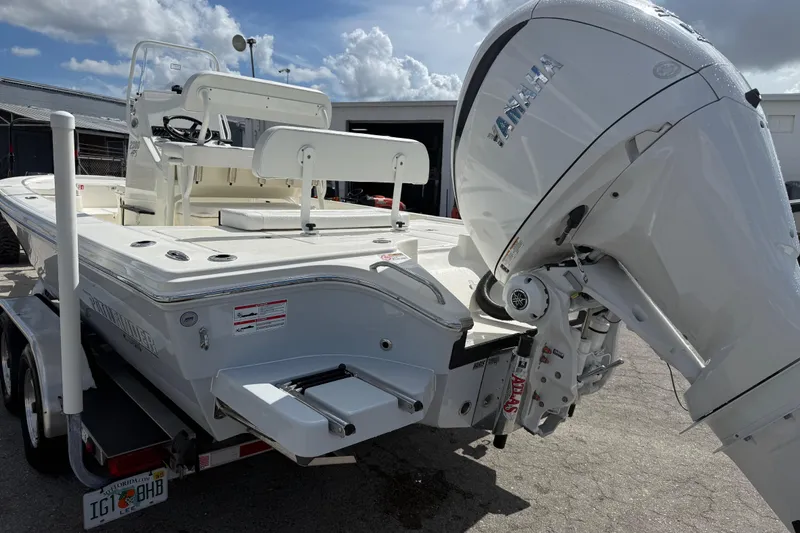 Slide: The Image of 2026 Pathfinder 2300 HPS boat with powerful 300 V6 engine, parked outdoors. - 4