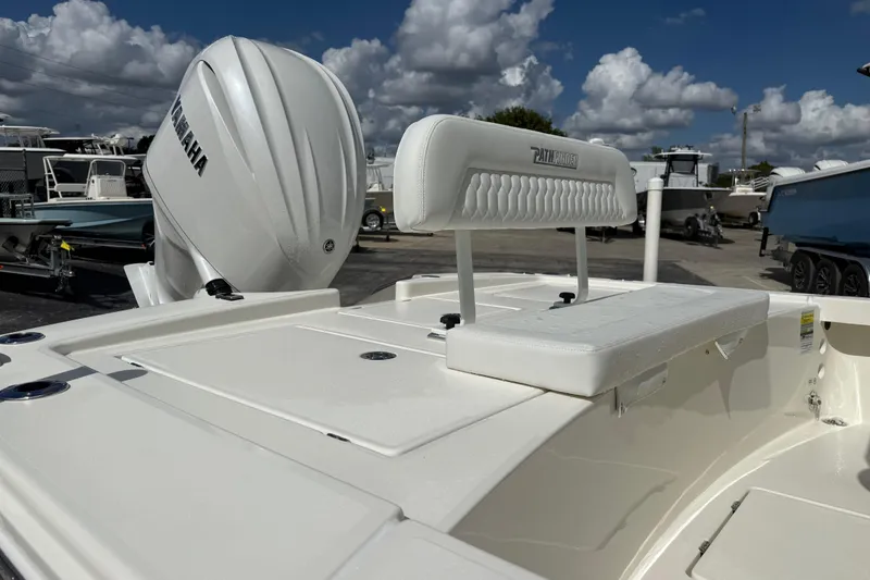 Slide: The Image of 2026 Pathfinder 2300 HPS boat with white seating and powerful outboard motor. - 8