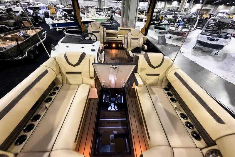 Slide: The Image of Luxurious interior of 2026 Montara Surf Boss EVO SLDH 25' boat at a showroom. - 10