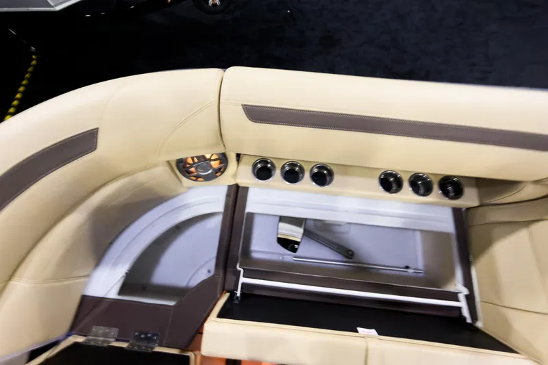 Slide: The Image of Interior of 2026 Montara Surf Boss EVO SLDH 25' with beige seating and control panel. - 12