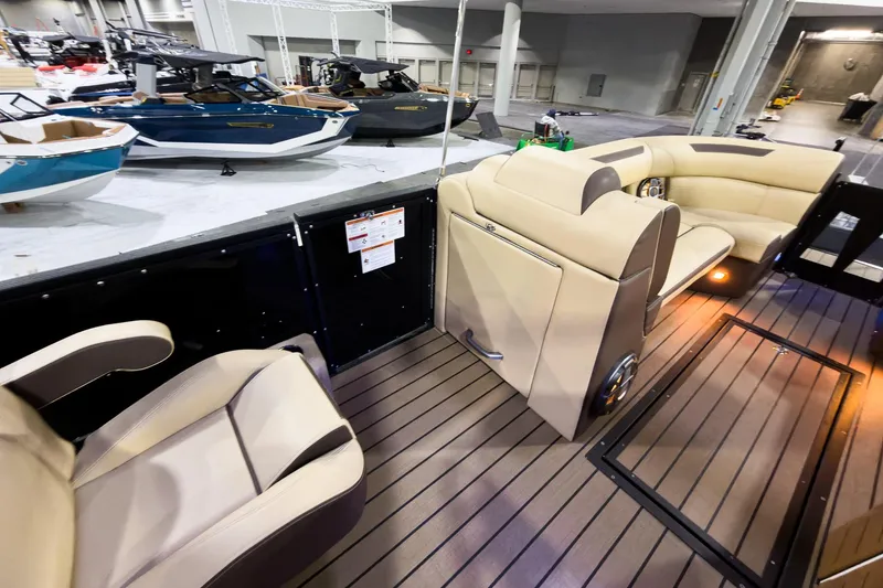 Slide: The Image of Luxurious interior of 2026 Montara Surf Boss EVO SLDH 25' boat at a showroom. - 13
