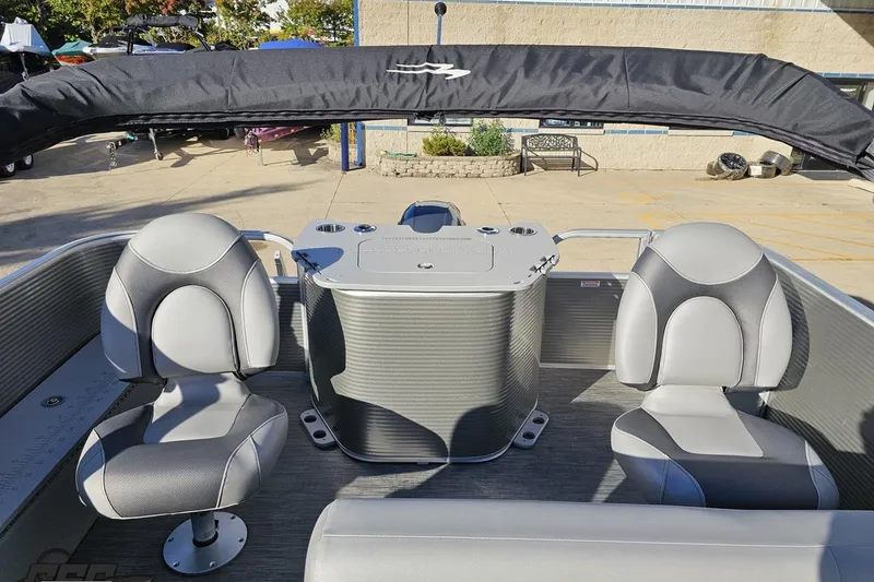 Slide: The Image of 2022 Bennington SX 21 Fishing boat interior with two gray seats and a control console. - 103