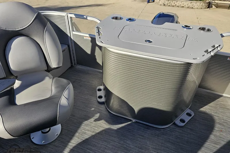 Slide: The Image of 2022 Bennington SX 21 Fishing boat interior with seating and storage compartment. - 104