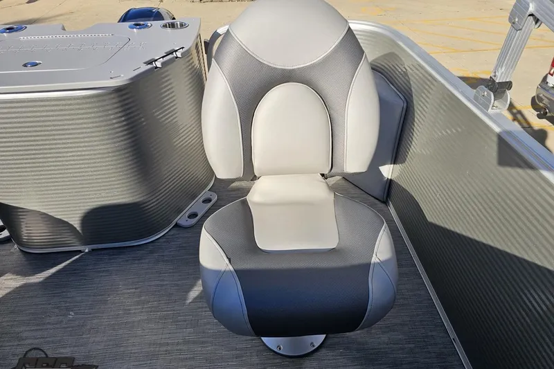 Slide: The Image of 2022 Bennington SX 21 Fishing boat seat, gray and white design, outdoor setting. - 111