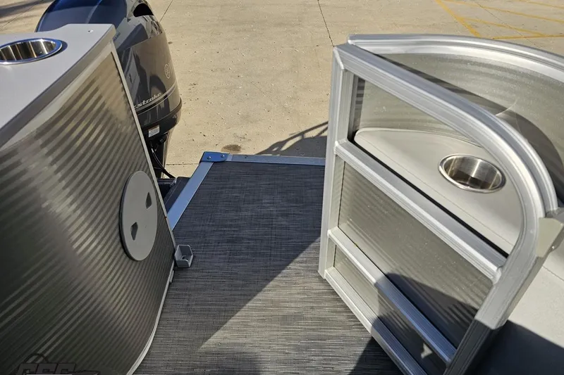 Slide: The Image of 2022 Bennington SX 21 Fishing boat deck with motor and storage compartments. - 114