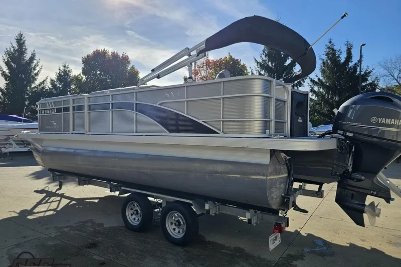 Slide: The Image of 2022 Bennington SX 21 Fishing pontoon boat on trailer with Yamaha outboard motor. - 28