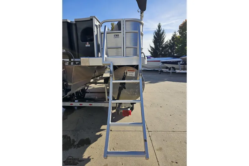 Slide: The Image of 2022 Bennington SX 21 Fishing boat ladder and rear view in a marina. - 35