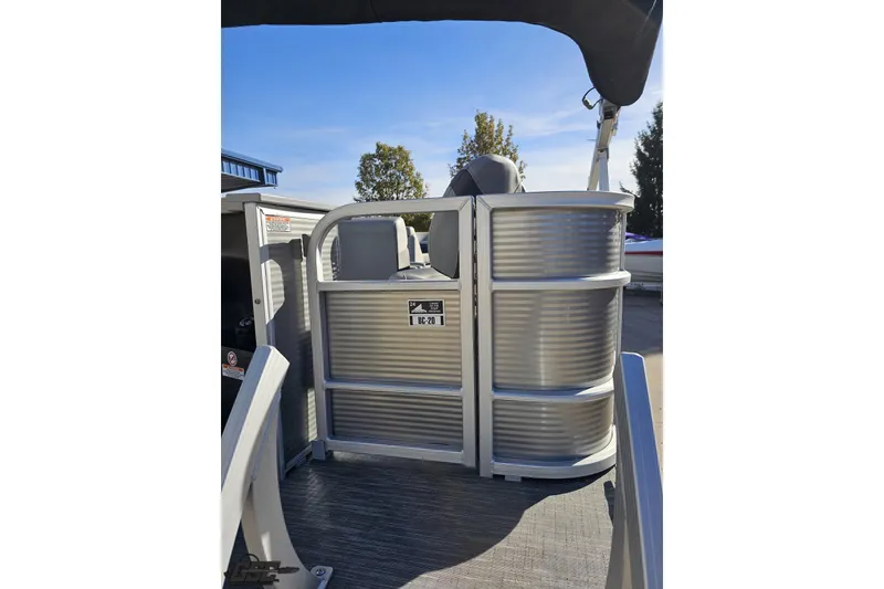Slide: The Image of 2022 Bennington SX 21 Fishing pontoon boat, rear view with seating and railing. - 36
