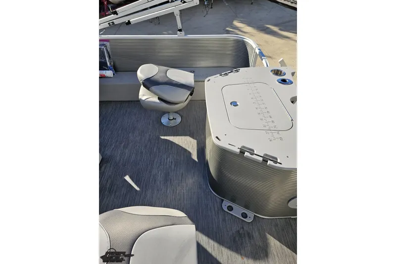 Slide: The Image of 2022 Bennington SX 21 Fishing boat interior with seating and storage compartments. - 46